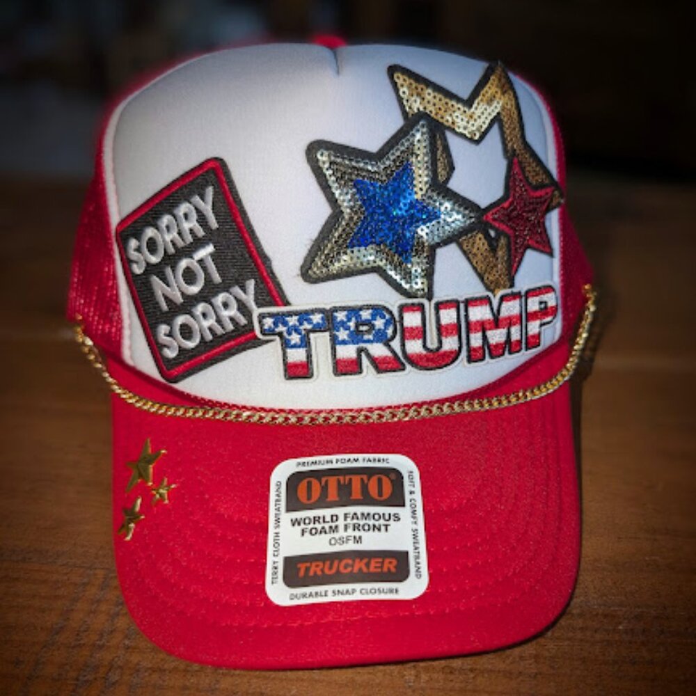 Trucker hat with iron on patches and embellishments.